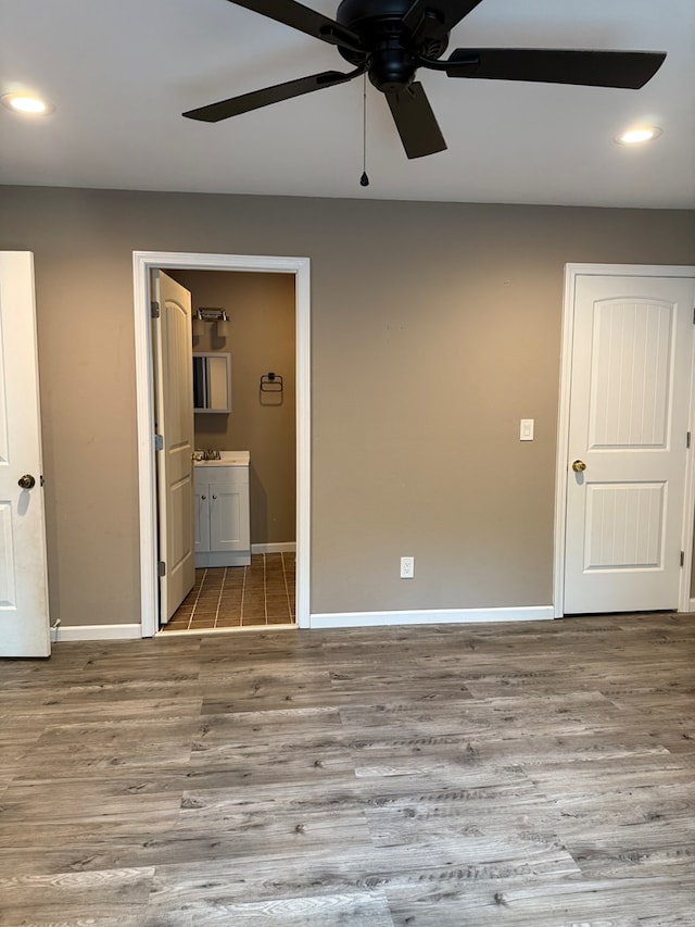 506 Teasley St, Dalton, GA 30721 - unfurnished bedroom featuring ensuite bathroom, recessed lighting, baseboards, wood finished floors, and ceiling fan