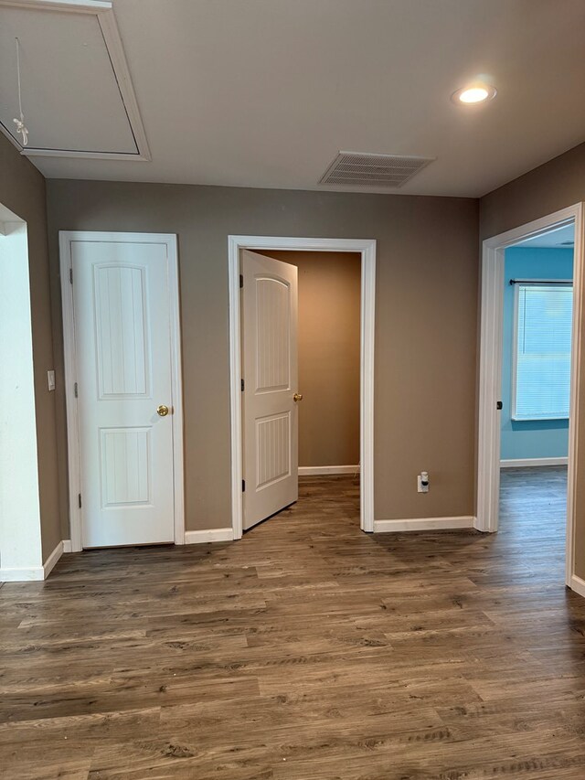 506 Teasley St, Dalton, GA 30721 - unfurnished bedroom featuring attic access, baseboards, wood finished floors, and recessed lighting