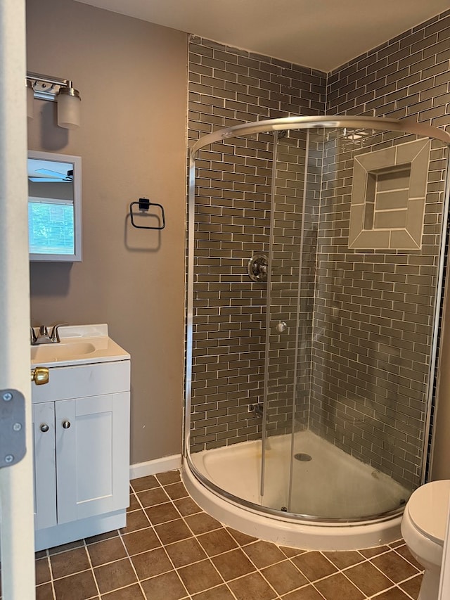 506 Teasley St, Dalton, GA 30721 - full bath featuring tile patterned floors, a shower stall, vanity, and toilet