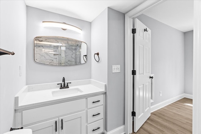 638 Pine Oaks Dr, Tunnel Hill, GA 30755 - bathroom with vanity, a shower, and wood finished floors