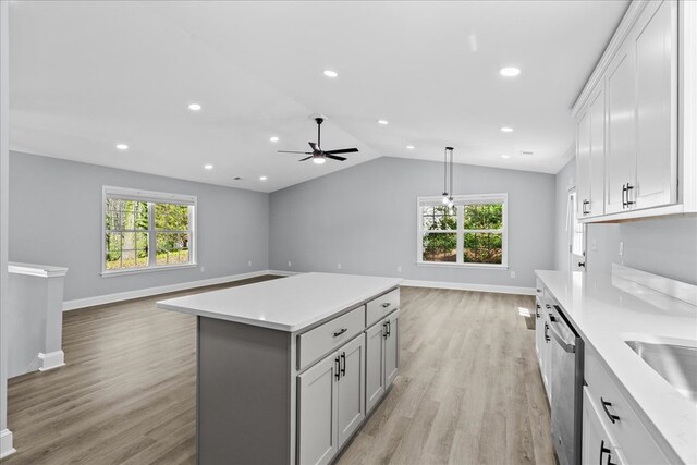 638 Pine Oaks Dr, Tunnel Hill, GA 30755 - kitchen with open floor plan, light countertops, a ceiling fan, stainless steel dishwasher, and vaulted ceiling