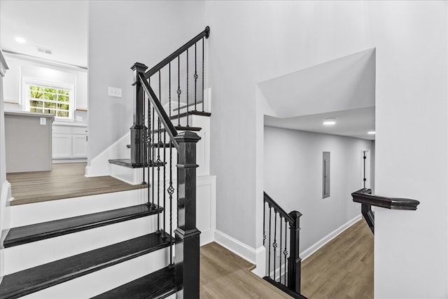 638 Pine Oaks Dr, Tunnel Hill, GA 30755 - stairs with wood finished floors and recessed lighting