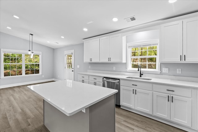 638 Pine Oaks Dr, Tunnel Hill, GA 30755 - kitchen with dishwasher, light countertops, a center island, light wood finished floors, and recessed lighting