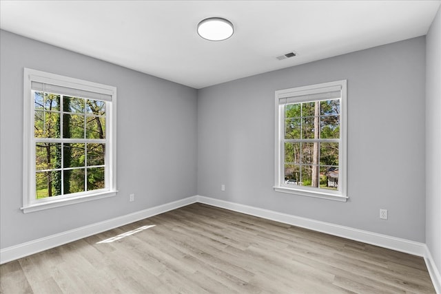 638 Pine Oaks Dr, Tunnel Hill, GA 30755 - empty room with plenty of natural light and wood finished floors