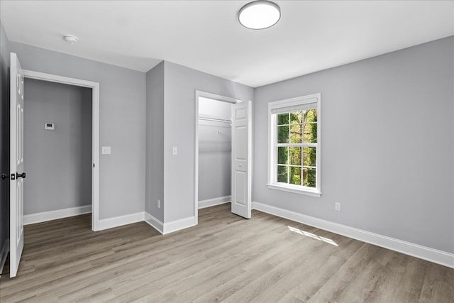 638 Pine Oaks Dr, Tunnel Hill, GA 30755 - unfurnished bedroom featuring wood finished floors and a closet