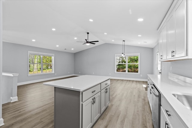 638 Pine Oaks Dr, Tunnel Hill, GA 30755 - kitchen with open floor plan, light countertops, a ceiling fan, stainless steel dishwasher, and vaulted ceiling