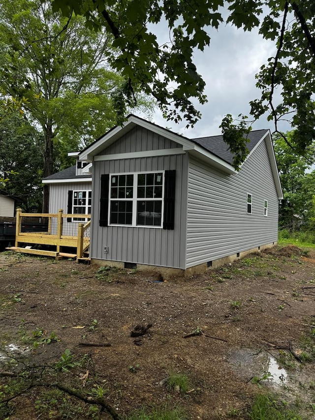 284 Biscayne Blvd, Rossville, GA 30741 - view of side of property featuring a wooden deck, board and batten siding, crawl space, and a shingled roof