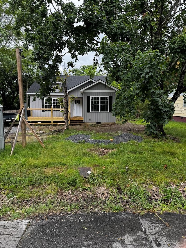 284 Biscayne Blvd, Rossville, GA 30741 - view of front facade with board and batten siding, a shingled roof, and a deck