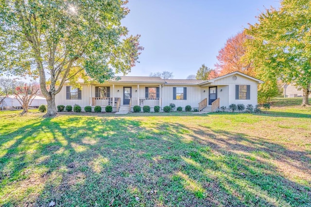 single story home with covered porch and a front lawn