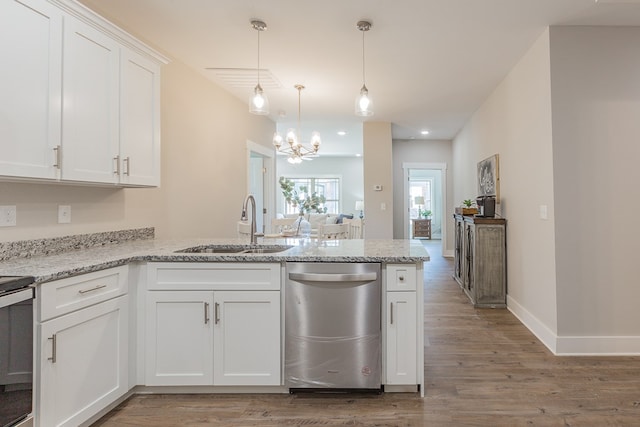 kitchen with white cabinetry, light stone countertops, dishwasher, and sink