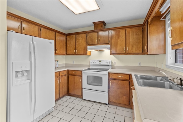 kitchen with light tile patterned flooring, white appliances, and sink