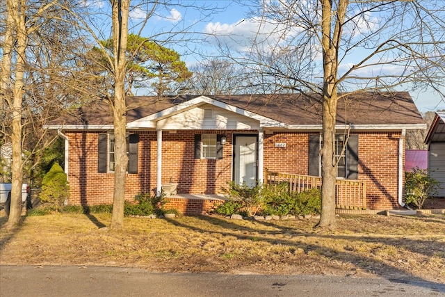 ranch-style house featuring covered porch