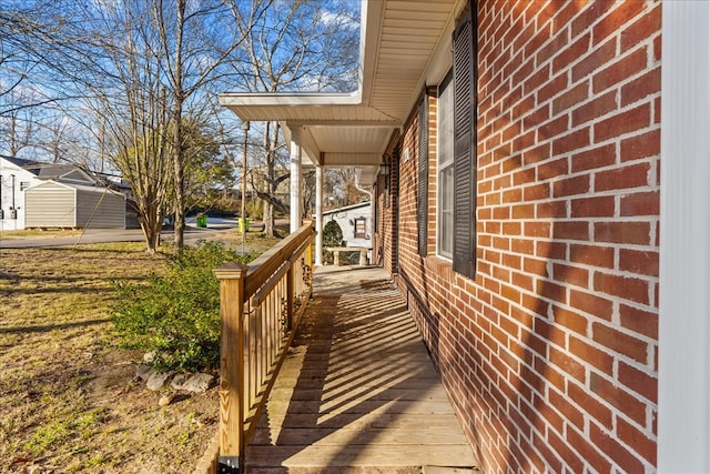 view of side of property featuring covered porch