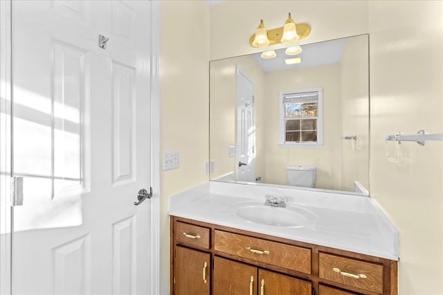 bathroom with vanity and toilet