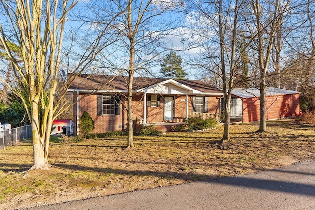 single story home with a porch