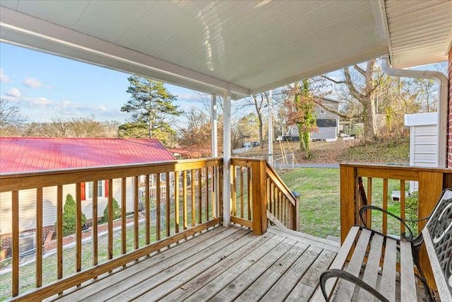 wooden terrace with a yard