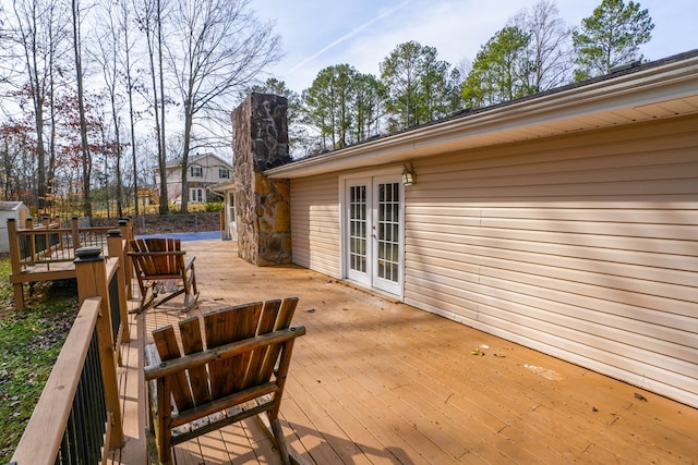 wooden deck featuring french doors