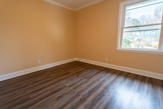 unfurnished room featuring visible vents, crown molding, baseboards, and dark wood-style flooring