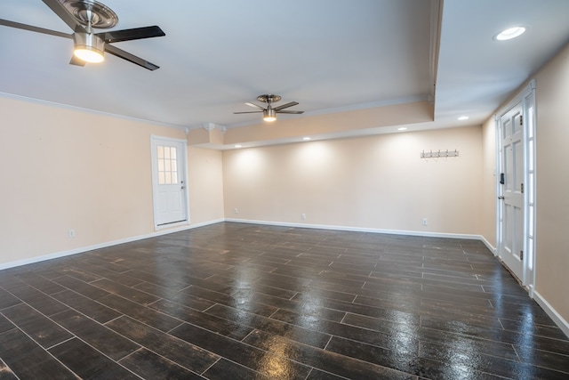 unfurnished room with ornamental molding, baseboards, ceiling fan, and wood finished floors