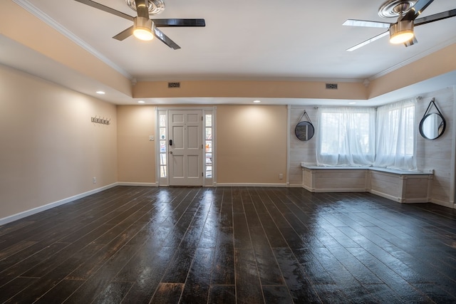 foyer entrance featuring dark wood-style floors, visible vents, baseboards, ornamental molding, and ceiling fan