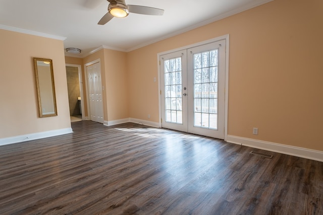 unfurnished room featuring visible vents, baseboards, dark wood finished floors, ornamental molding, and french doors