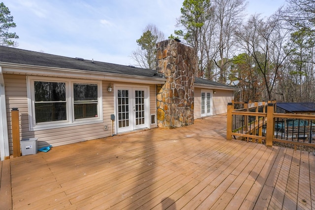 wooden deck featuring french doors