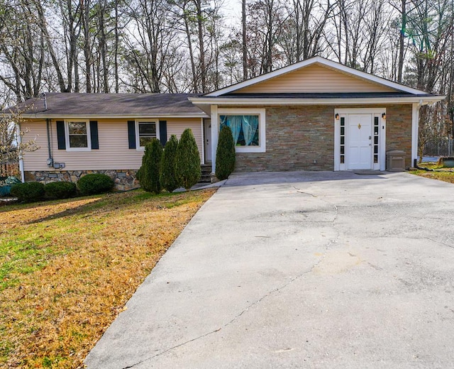 8011 Starr Dr, Dalton, GA 30721 - ranch-style house featuring stone siding, driveway, and a front lawn