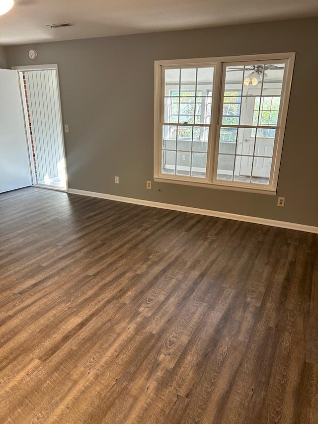 1935 Meadowbrook Cir Unit C, Dalton, GA 30720 - empty room featuring baseboards, dark wood-style flooring, and visible vents