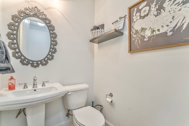 bathroom featuring sink and toilet