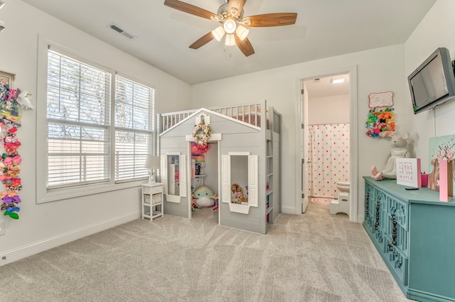 playroom with light colored carpet and ceiling fan