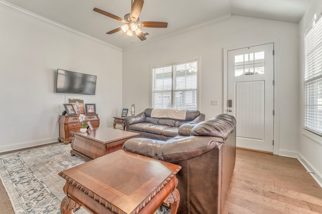 living room with ceiling fan, light hardwood / wood-style flooring, crown molding, and a wealth of natural light