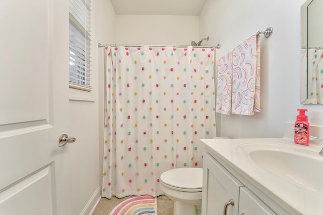 bathroom featuring toilet and vanity