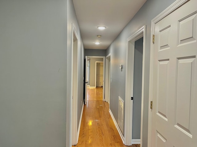 hall with light hardwood / wood-style flooring