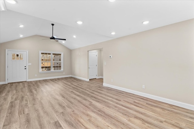 unfurnished living room with light wood-style floors, vaulted ceiling, baseboards, and ceiling fan