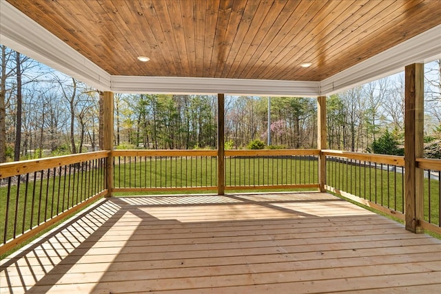 wooden deck with a lawn