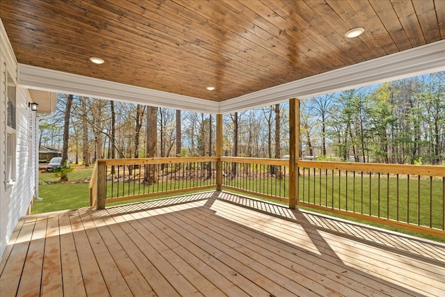 wooden terrace with a lawn