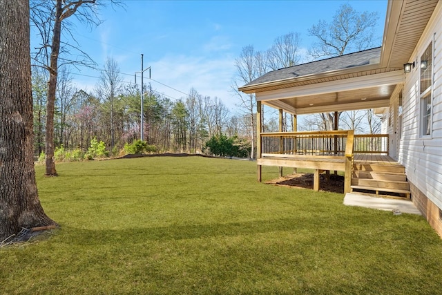 view of yard with a deck