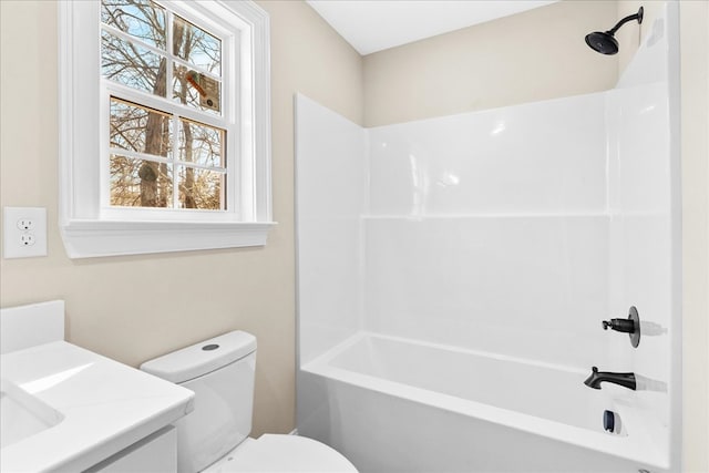 full bath featuring toilet, vanity, and bathing tub / shower combination
