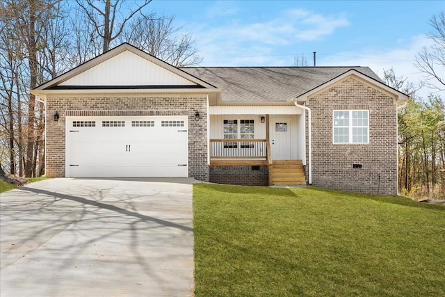 view of front of property with driveway, covered porch, brick siding, an attached garage, and a front yard