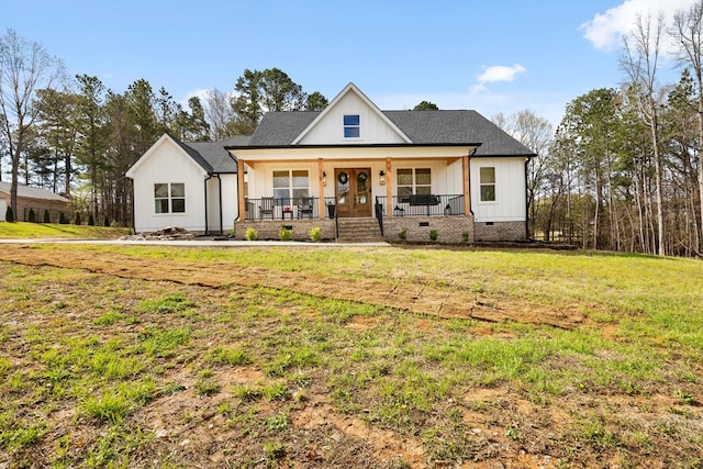 modern inspired farmhouse with a porch, crawl space, board and batten siding, and a front lawn