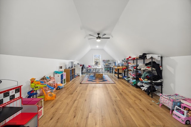 rec room featuring vaulted ceiling, wood-type flooring, and ceiling fan