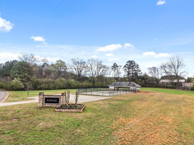 view of yard with a carport and fence