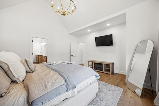 bedroom featuring high vaulted ceiling, recessed lighting, light wood-style floors, an inviting chandelier, and baseboards