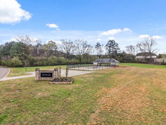view of yard with a carport and fence