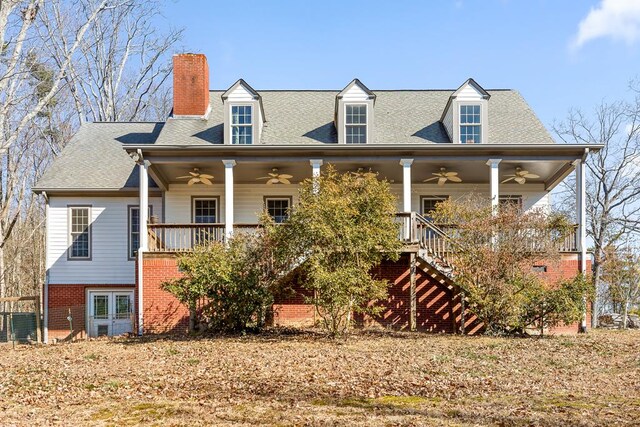 back of house with a porch and ceiling fan