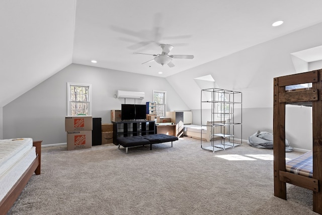 bedroom with multiple windows, vaulted ceiling, a wall mounted air conditioner, and light colored carpet