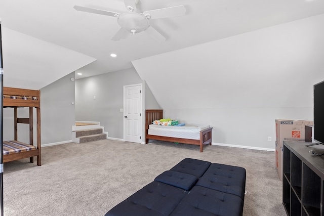 bedroom featuring light carpet, lofted ceiling, and ceiling fan