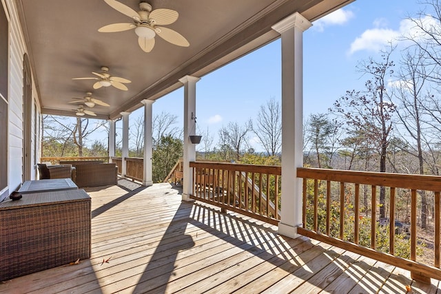 deck featuring an outdoor living space and ceiling fan