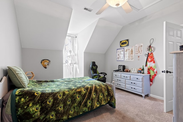 carpeted bedroom with ceiling fan and vaulted ceiling