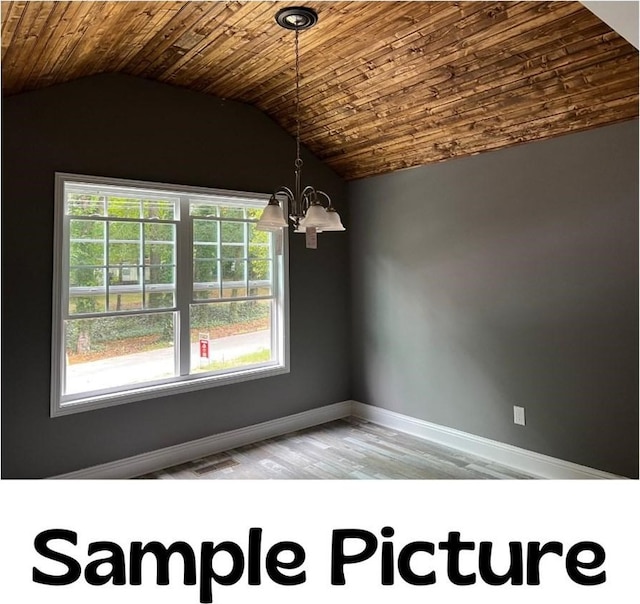 LOT4 River Bend Rd, Dalton, GA 30721 - unfurnished room with a chandelier, wood finished floors, baseboards, lofted ceiling, and wooden ceiling